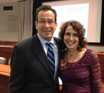 Governor Malloy and Dr. Cappello smiling together in a hearing room