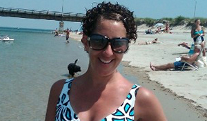 Susan in sunglasses at the beach