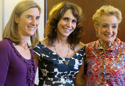 Dr. Cappello smiling between two fellow advocates