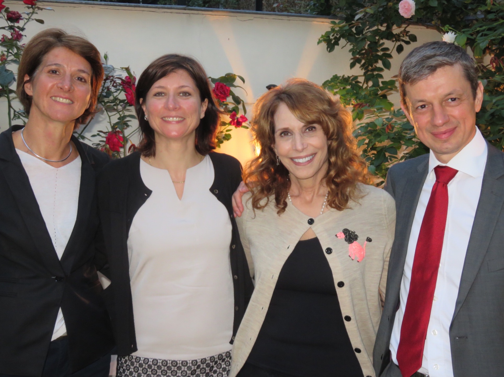 Dr. Cappello with three colleagues in an evening garden in Paris