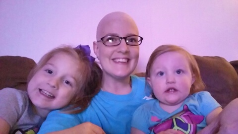 Brittany, bald from treatment, with two young children