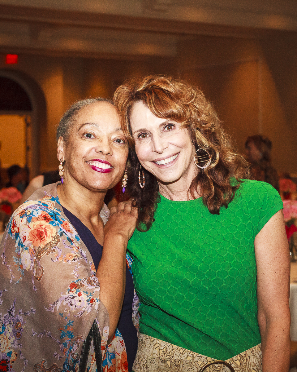 Dr. Cappello embracing a guest at the reception