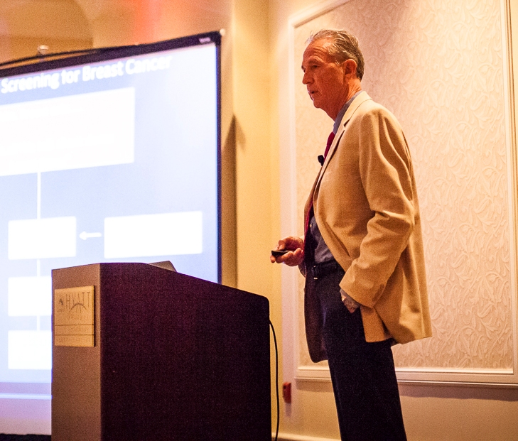 Dr. Richard Reitherman presenting slides on breast cancer screening