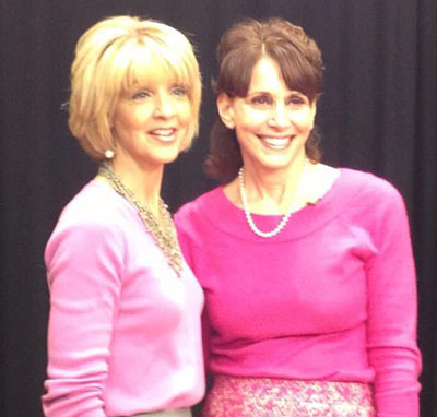 Ann Nyberg and Dr. Cappello, both in pink, posing together