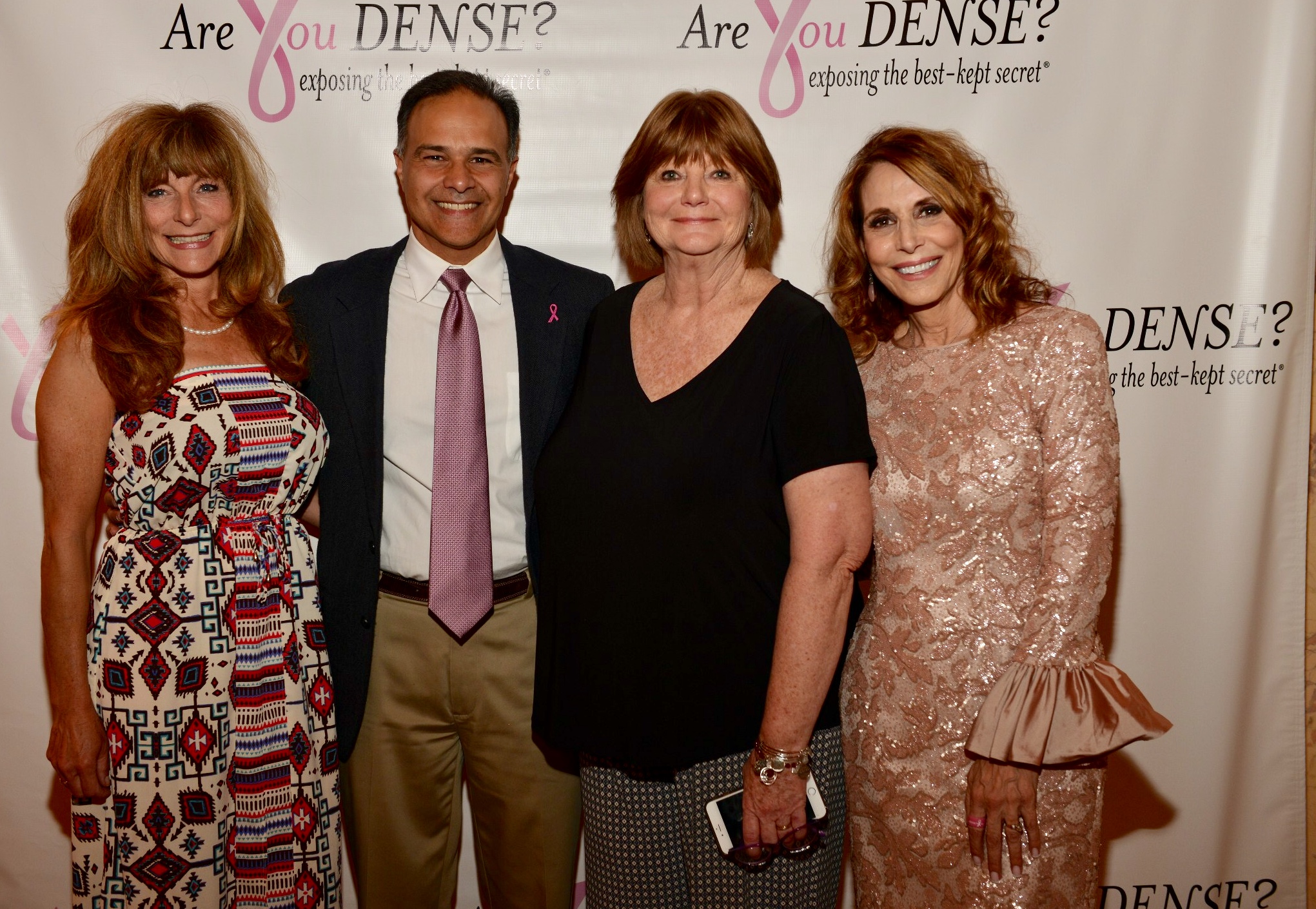 Honoree Dr. Marco Verga with Dr. Nancy Cappello and two guests at the Are You Dense? backdrop