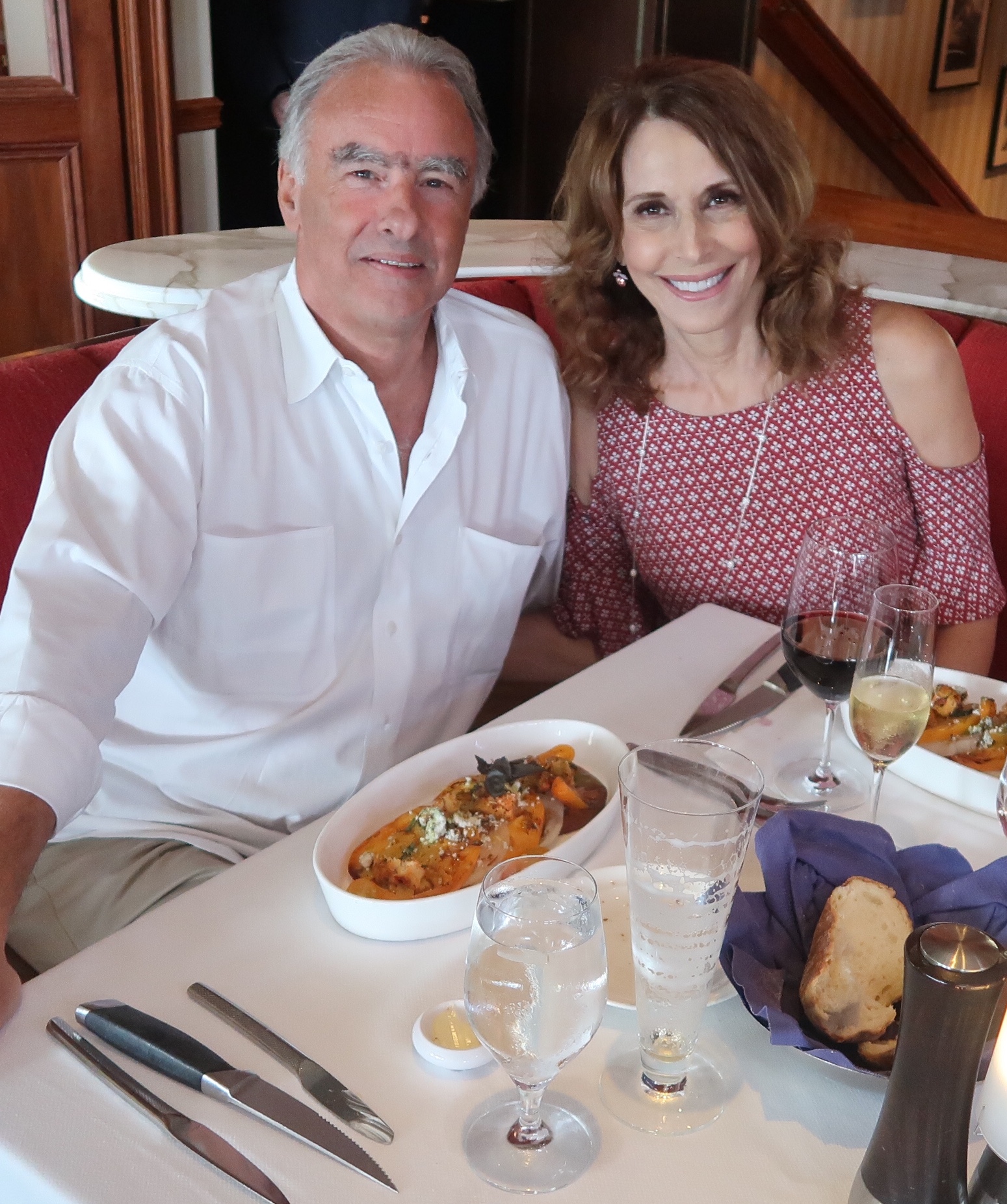 Joe and Nancy Cappello smiling at a restaurant table