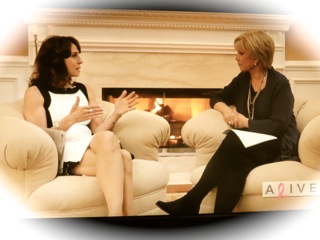Dr. Cappello and Joan Lunden talking by a fireplace on the Alive With Joan set