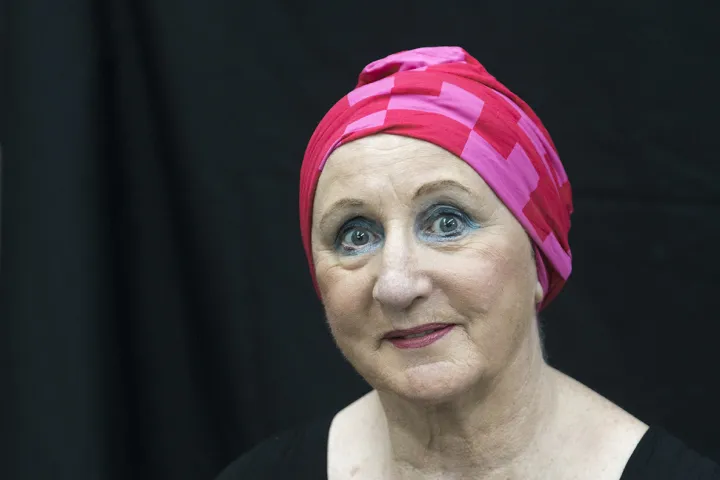 Portrait of Jean in a pink head wrap